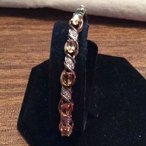 A citrine bangle bracelet in 14k over ss